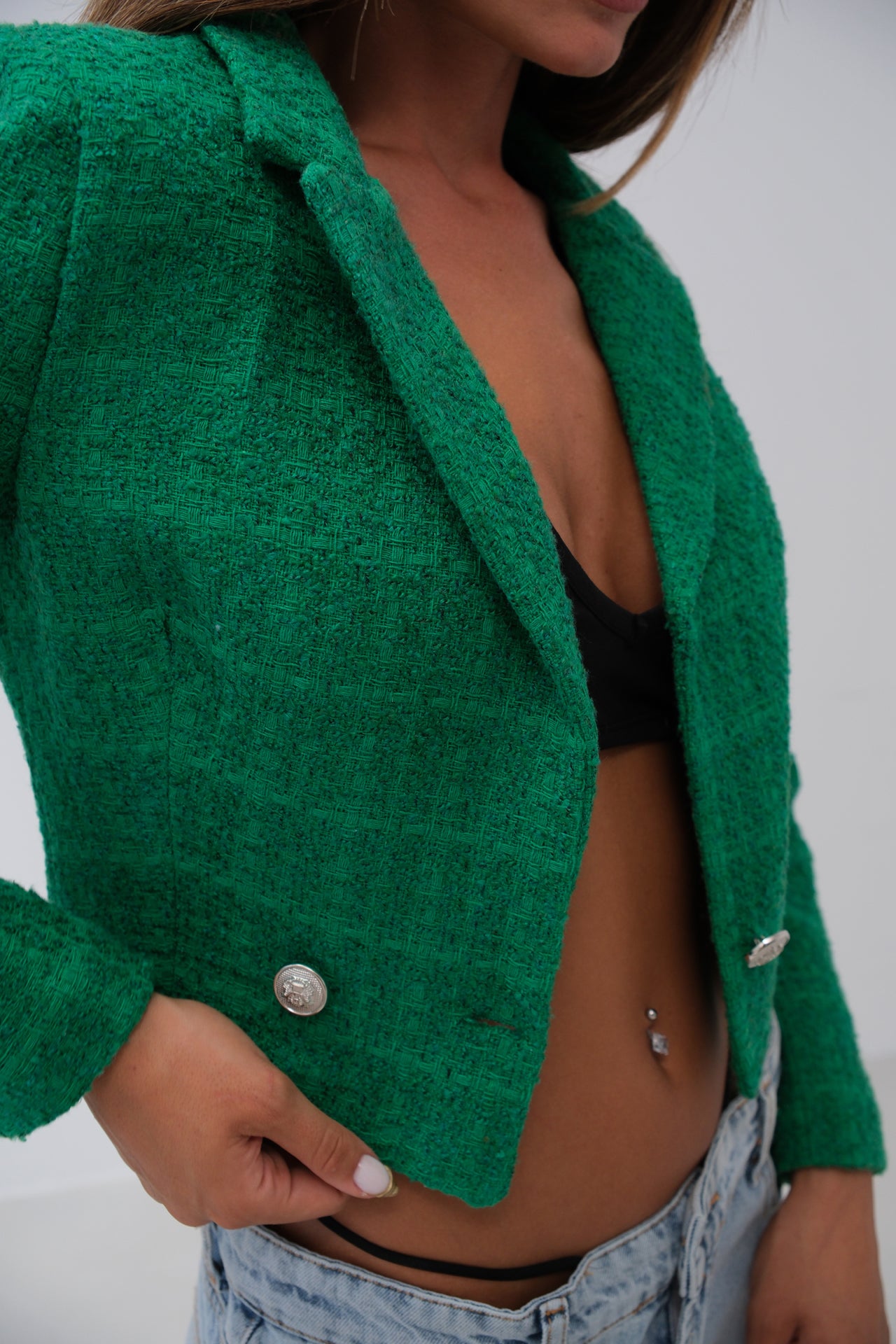 Bouclé fabric detail of emerald green cropped blazer with silver buttons – LARYVOE women’s fashion