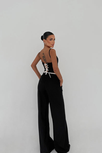 Back view of pinstripe cut-out set with lace-up corset detail.