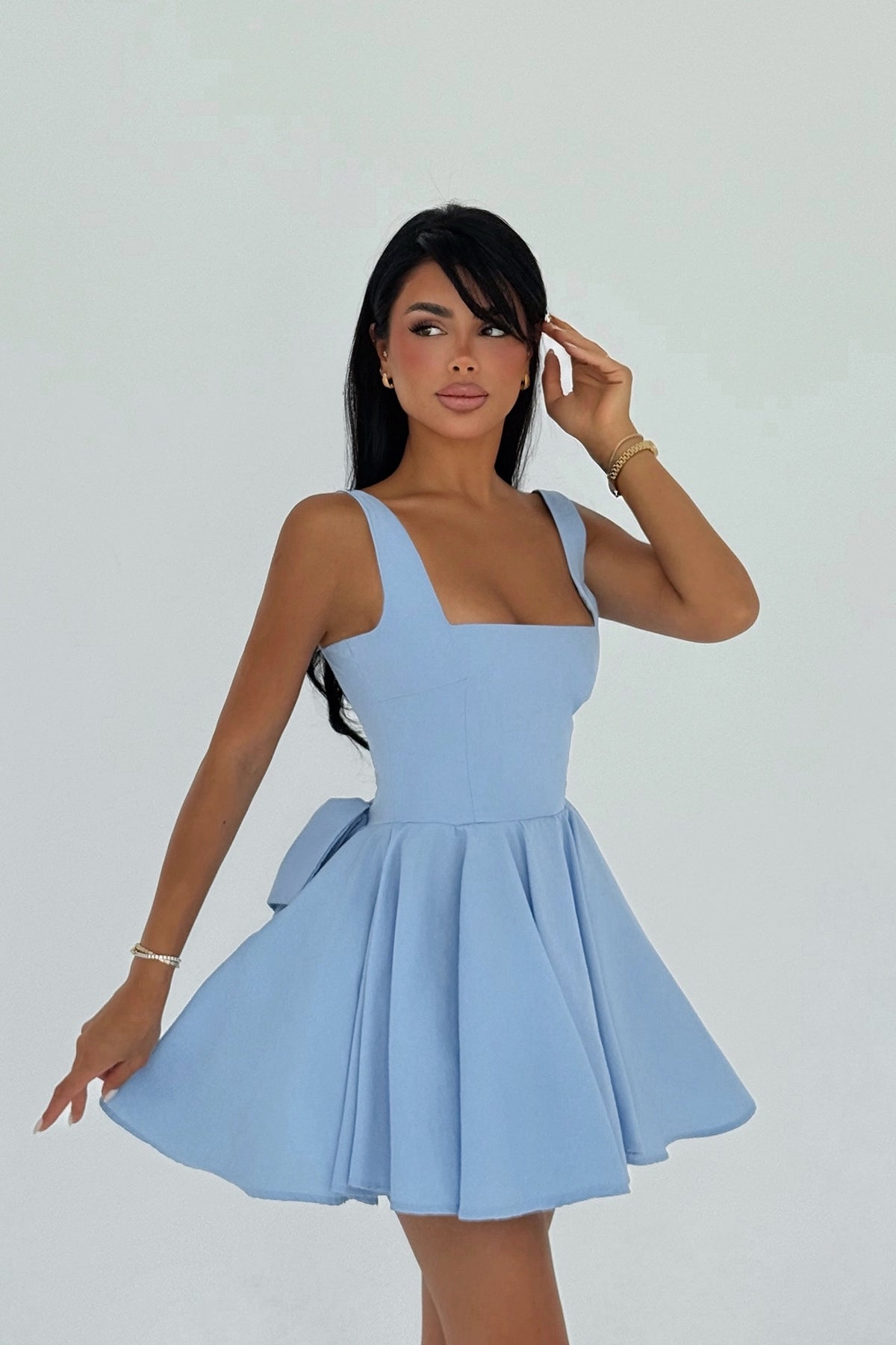Model wearing blue bow-back skater dress with flared skirt – LARYVOE women’s clothing